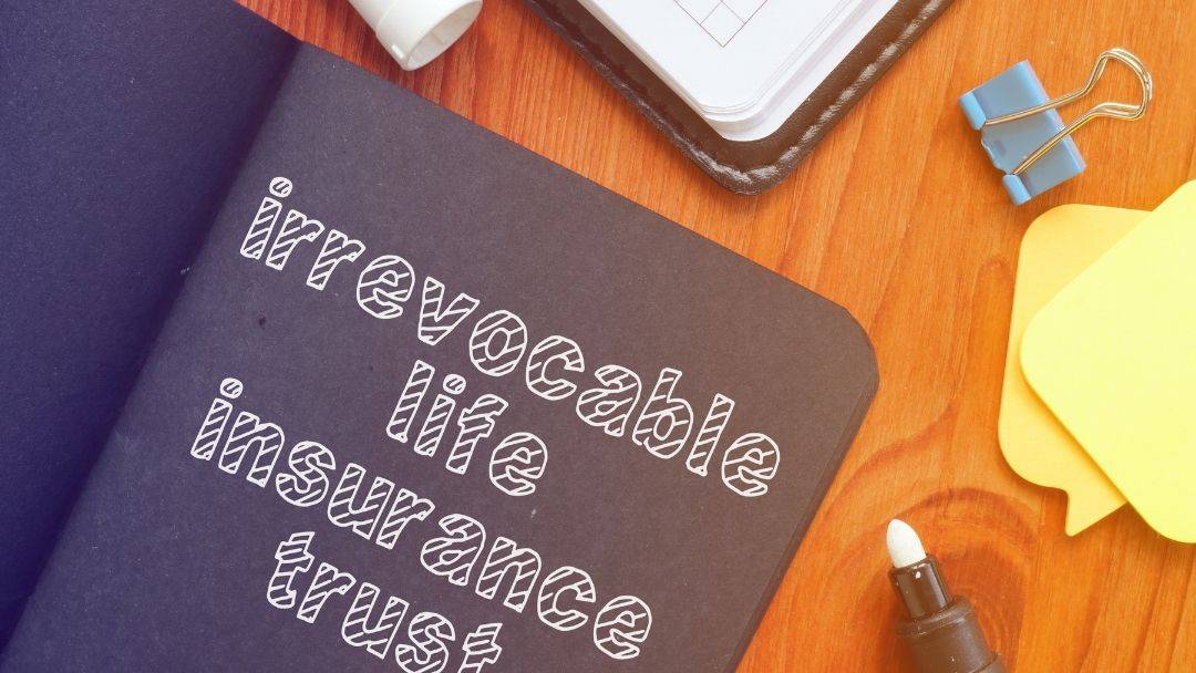 Irrevocable life insurance trusts - decorative image of a book on a desk